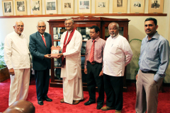 S.H.M. Jameel presenting copy of