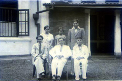 Standing: Ummu, Raheema & Azeez<p>Seated: Abdulla Ismail, S.M. Aboobucker & Cassim Ismail</p><p>(taken at</p>