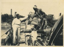 Azeez reminiscing with a farmer on the ferry near Panama, May 1960